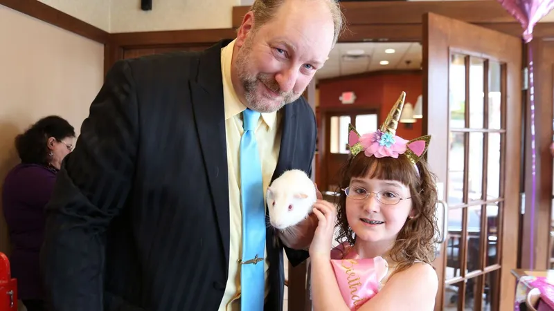 Mike and girl with guinea pig
